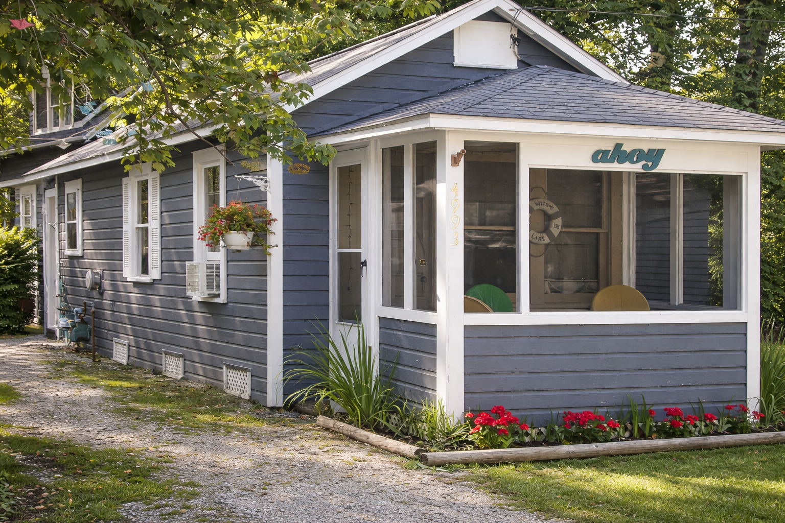 Cozy beach cottage with "ahoy" sign